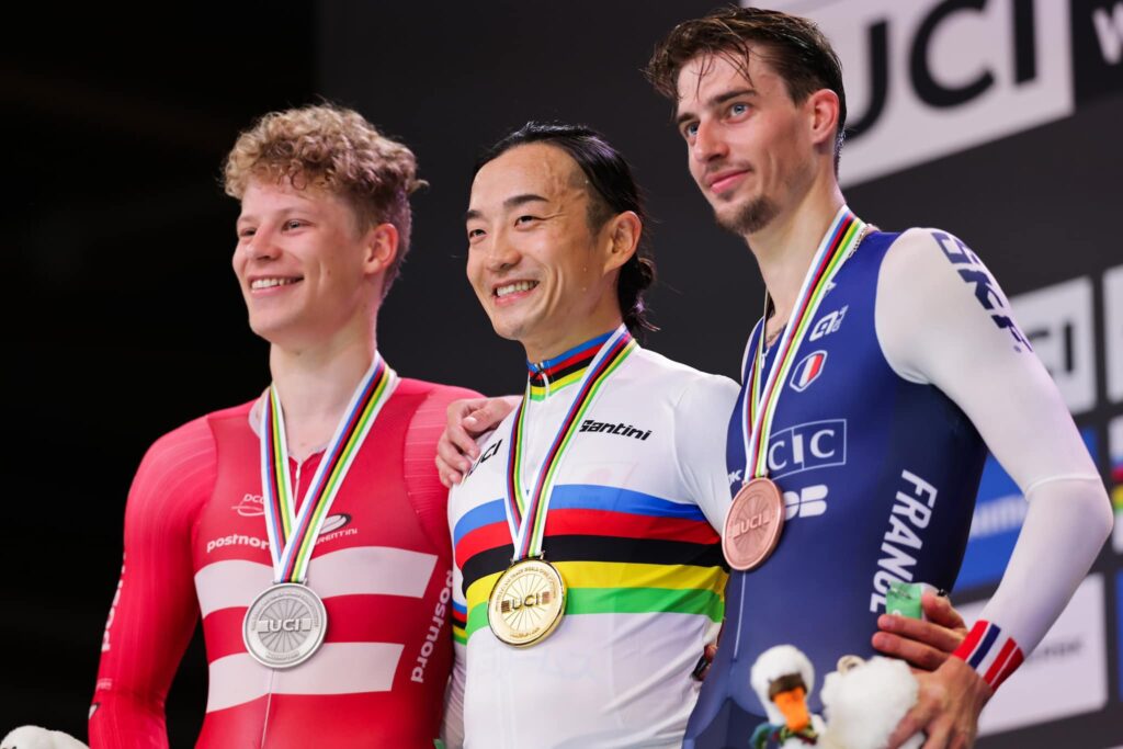 Picture by Alex Whitehead/SWpix.com - 17/10/2024 - Cycling - Tissot UCI 2024 Track World Championships Ballerup  - Copenhagen, Denmark - Ballerup Super Arena - Men's Scratch Race Podium - Kazushige Kuboki (Japan) receiving the Gold Med and becoming World Champion with Tobias Aagaard Hansen (Denmark) receiving the Silver Medal and Clement Petit (France) receiving the Bronze Medal